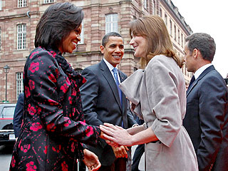 Michelle Obama Presents Carla Bruni-Sarkozy with a Guitar