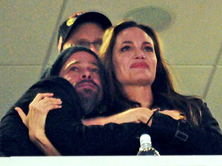 Brad Pitt and Angelina Jolie in Loving Mood at the Super Bowl