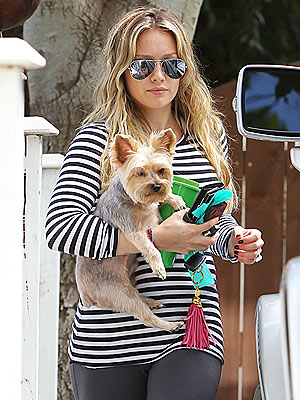 Hilary Duff Pregnant, Hides Baby Bump with Dog