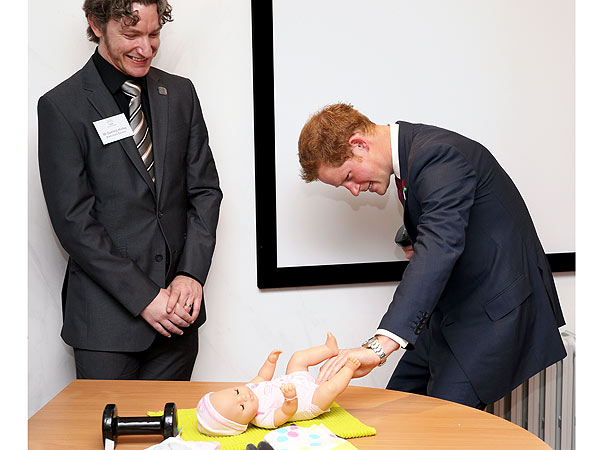 Prince Harry Changes a Diaper (Awkwardly!)