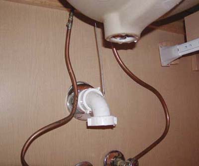 missing P-trap and drain under bathroom sink