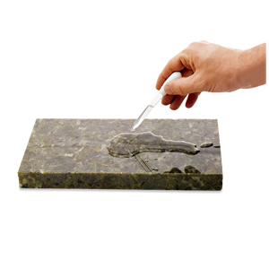 man holding a dropper with sealant in it above a stone slab