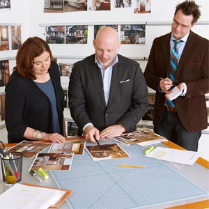 TOH editor Scott Omelianuk, center, reviews Reader Remodel Contest entries with deputy editor Kathryn Keller and special projects editor Eric Hagerman.