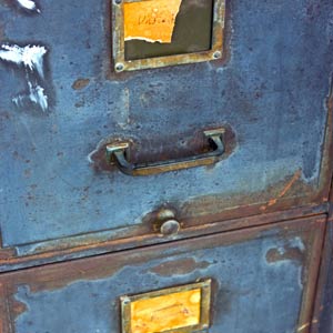 rusty old steel filing cabinet with peeling paint