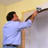 Conceal the new drywall patches with drywall tape and joint compound