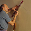 marking a wall to cut out drywall for niche installation
