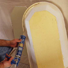 apply adhesive for preliminary install of niche into wall-opening