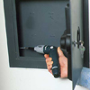 Secure the safe to the wall with screws.
