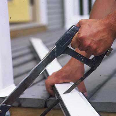 1. Cut the rolled-up screen and aluminum storage cassette down to size with a high-tension hacksaw.