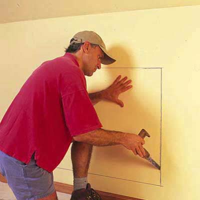 makring the outline of the dresser in the wall