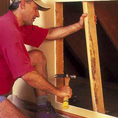 remove studs and insulation from inside the wall to make room for the dresser