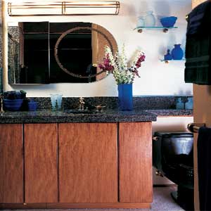 bathroom counter, mirror and toilet