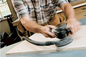 Norm Abram using a random-orbit sander