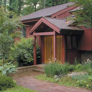Larger after -view of split level house with new entryway.
