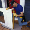Insert the flexible rubber fin into the slot in the expander sweep and slip the expander onto the bottom of the door