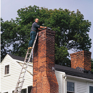 man climbing on the chimney