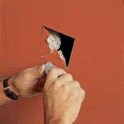 preparing the drywall hole