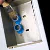 cleaning washing machine filters with bristle brushes