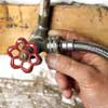 Attaching washing machine hoses to water supply