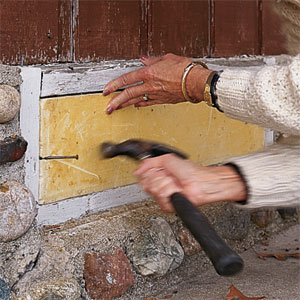 sealing up a crawl-space vent with rigid foam block