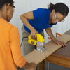 cutting wood to the sizes needed to build a tree swing