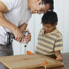 using a drill to help assemble the tree swing seat