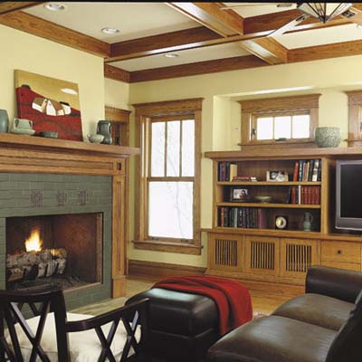 family room has coffered ceiling, fireplace, and handmade tiles with motifs
