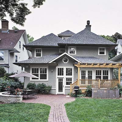 back deck steps to a brick patio  
