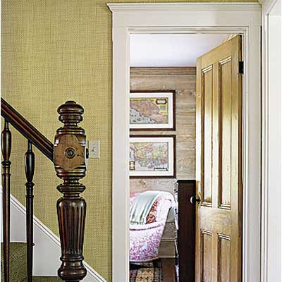 den, relocated stairs with newel post, salvaged pine floors in Sag Harbor home