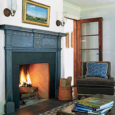living room with antique mantel and salvaged doors in Sag Harbor home