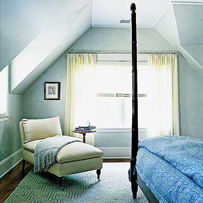 master bedroom with window dormers and a vaulted ceiling in Sag Harbor home