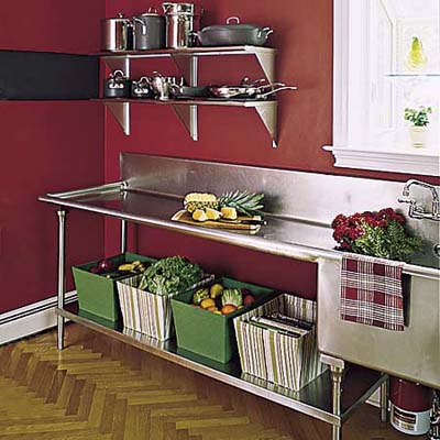 salvaged 10-foot-long stainless-steel pot-washing sink with under-counter storage and parquet floor in renovated Queen Anne's kitchen