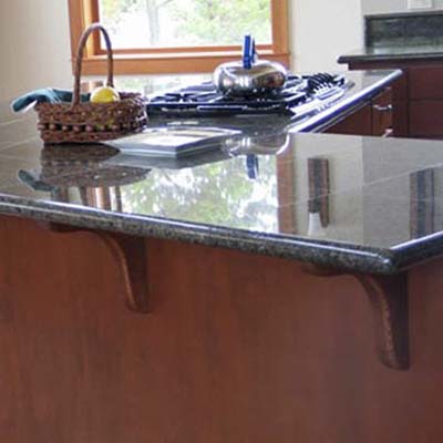 close-up view of a countertop constructed with Benissimo granite tiles