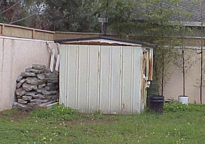 Damaged shed before demolition