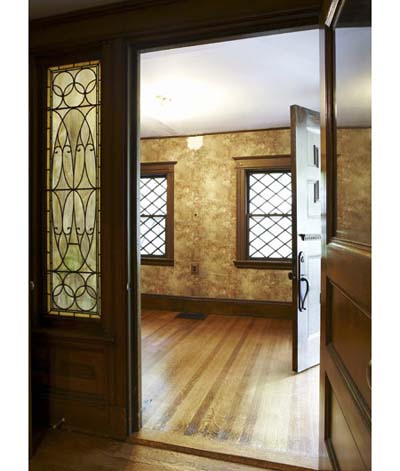 entryway with solid door and stained-glass windows
