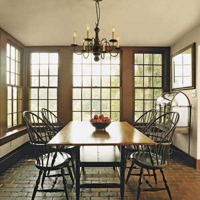 breakfast room with double-hung windows and brick floor in Ravenroyd