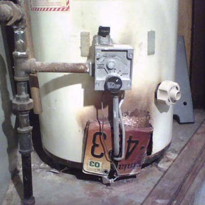 old license plate for car attached to water heater