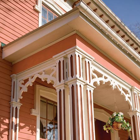 Italianate porch, columns, windows, and brackets after remodel