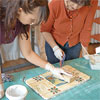 clean off the excess grout, seal and use your new table