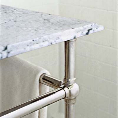 marble top sink on a three legged stand