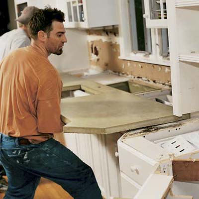 men carrying concrete countertop