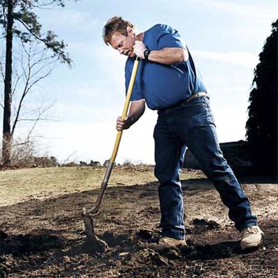 do flip a round-point shovel around, orientating the back of the shovel head parallel to the hole