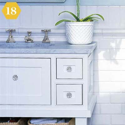 White subway tiles make chair rail in bathroom