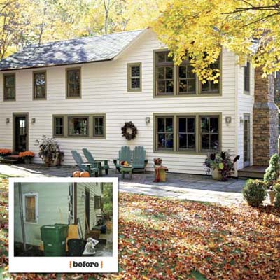 before and after views showing the new windows and bluestone patio at the back of this farmhouse remodel
