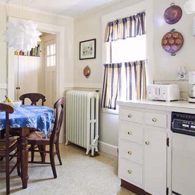 before shot of newton centre kitchen displaying lack of cabinetry and entry way wall to be removed