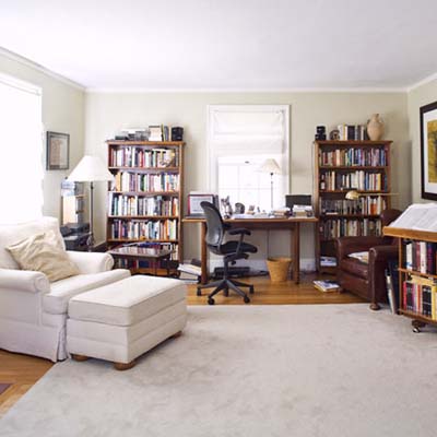 before view of the first-floor family room that doubles as a makeshift office for one of the homeowners