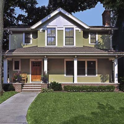 remodel in Minneapolis, MN with altered roofline, new paint job, energy-efficient windows and painted on address numbers
