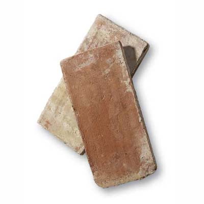 antique terra-cotta floor tiles refine the brick floor look
