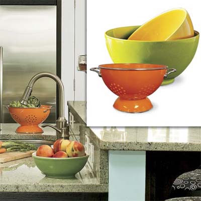 colorful earthenware nesting bowls and an enameled stainless-steel colander inset in image of remodeled bungalow kitchen