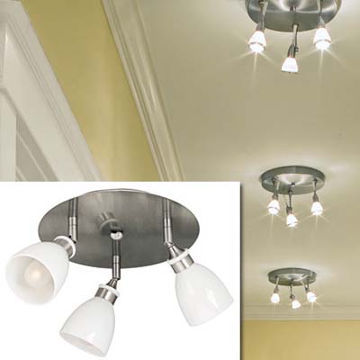 a trio of spotlights inset in the image of the decorated hallway of this remodeled bungalow kitchen